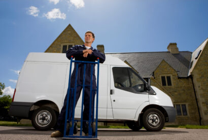 Man with a van outside house.