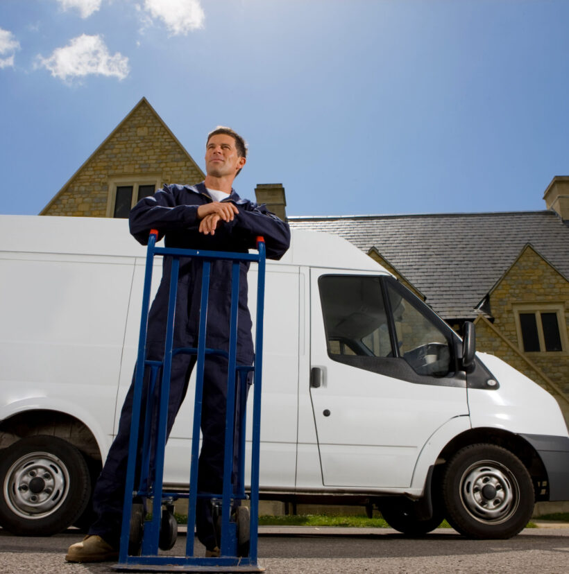 Man with a van outside house.