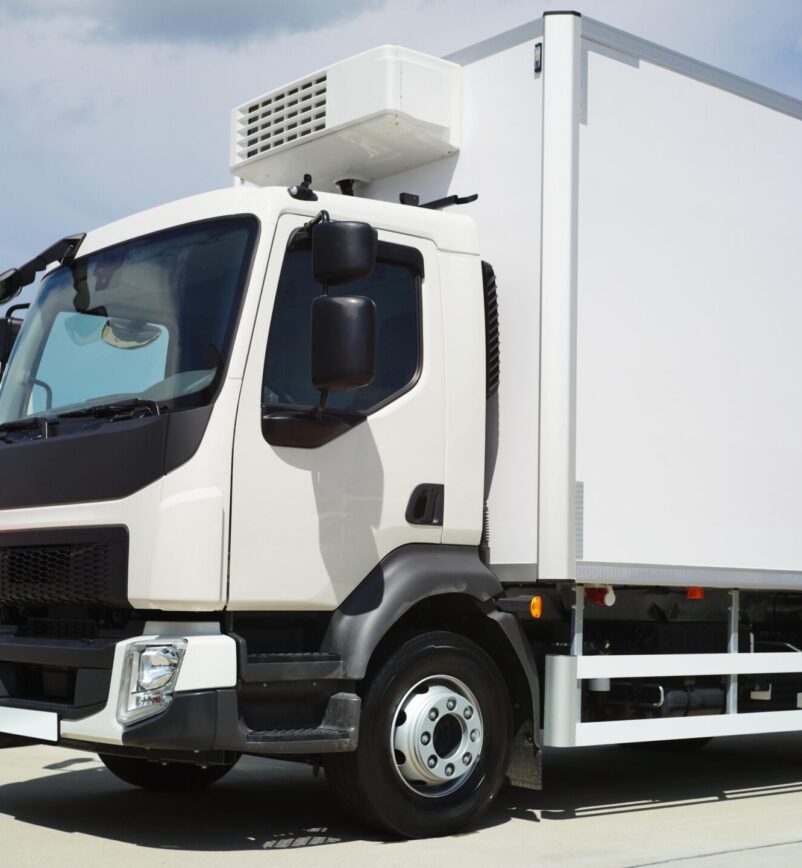 A clean, secure temperature-controlled delivery van parked.